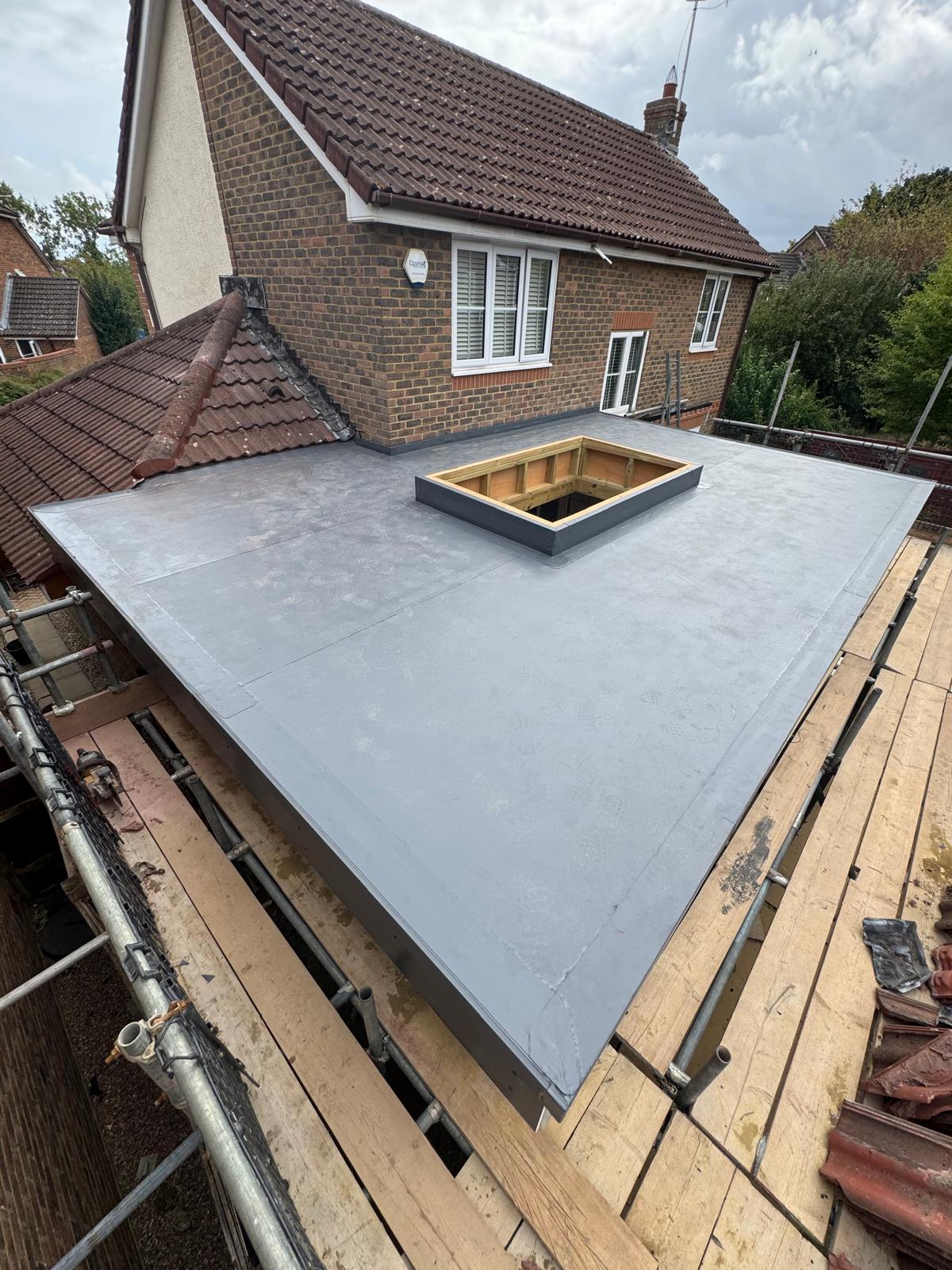 DM Roofing — completed EPDM flat roof with rooflight, residential extension, professional finish