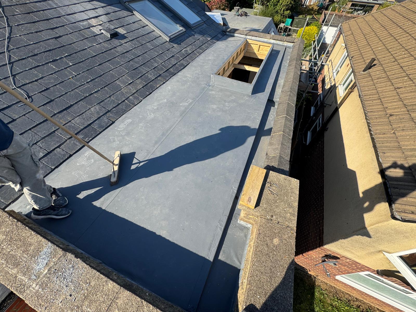 DM Roofing — completed EPDM rubber flat roof with Velux windows, terraced property