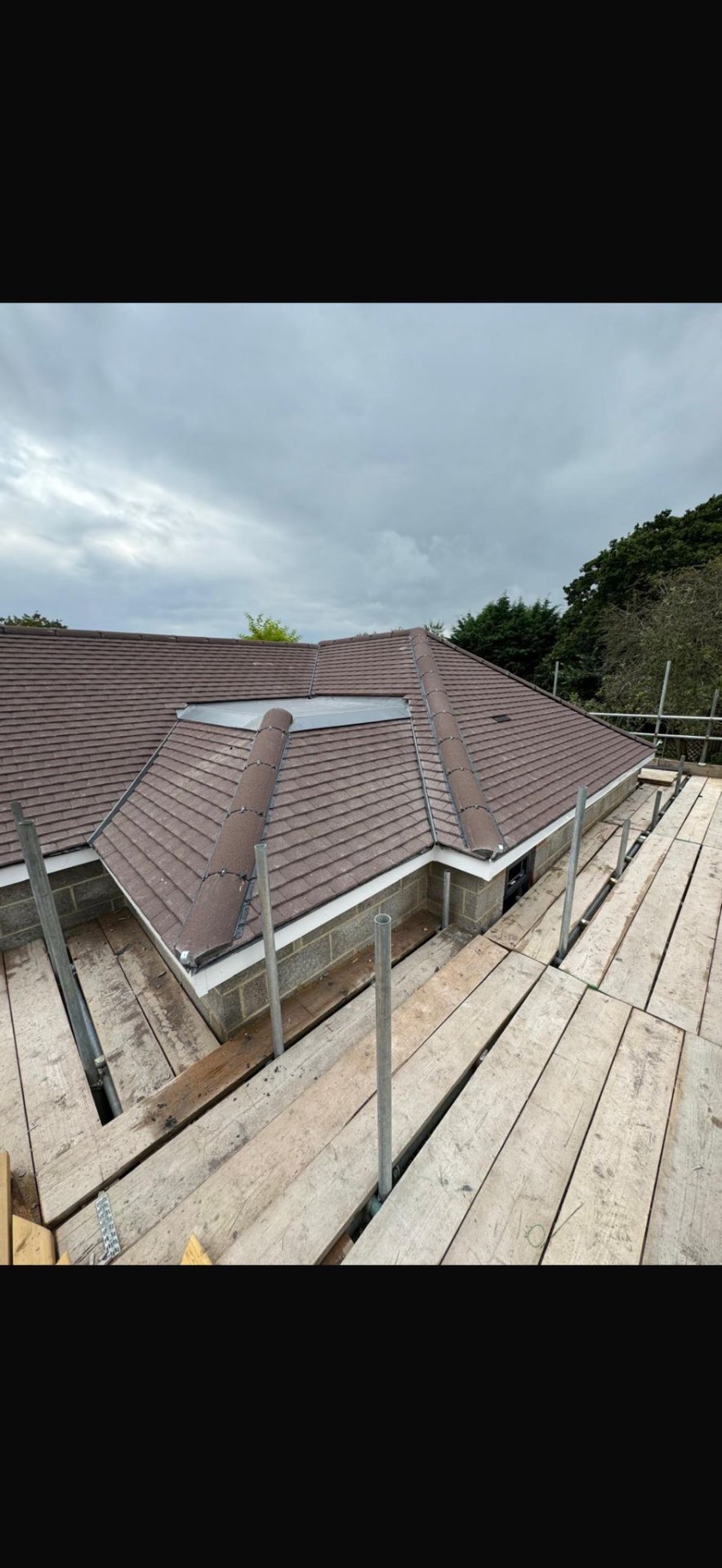 DM Roofing — completed plain tile pitched roof with Velux skylight, hip and valley detail, view two