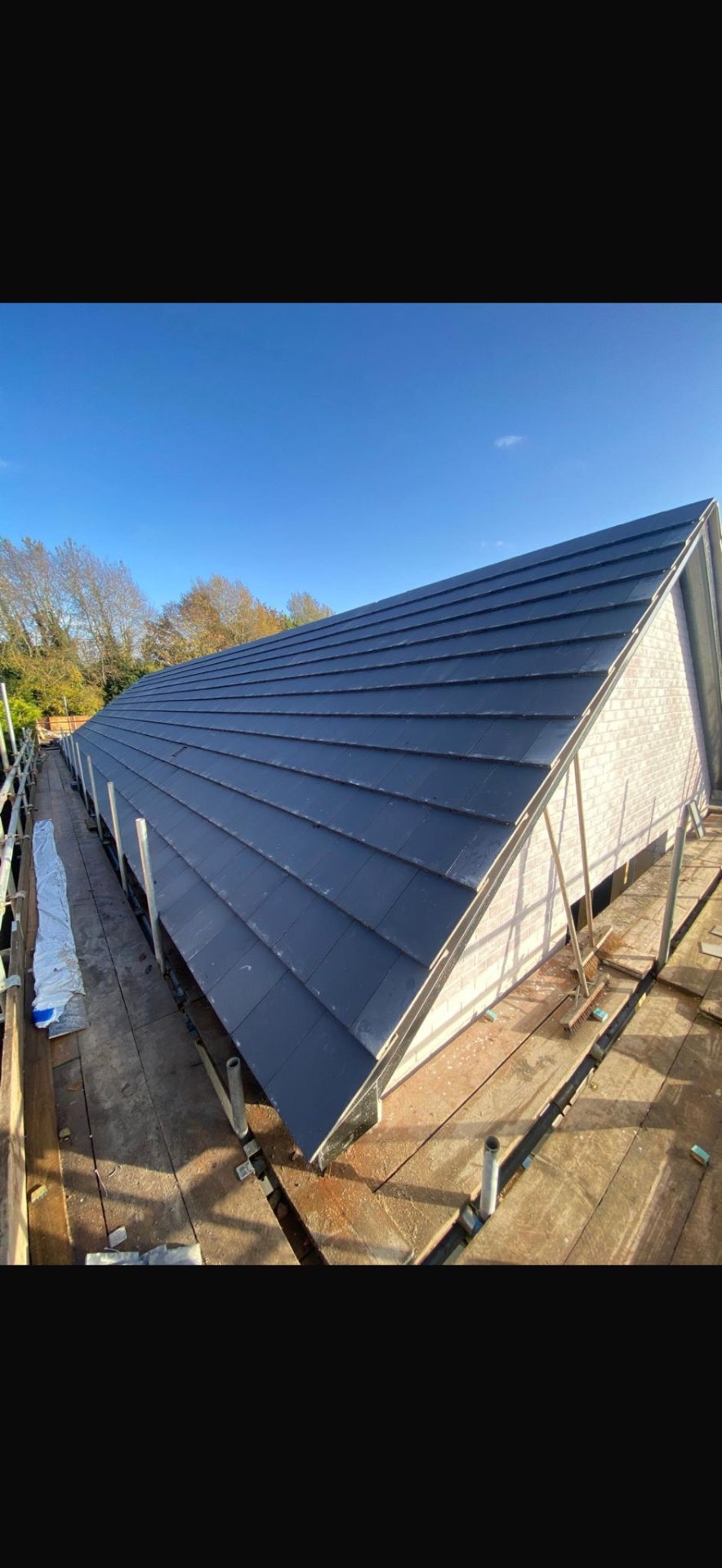 DM Roofing — completed EPDM rubber flat roof with Velux windows, terraced property